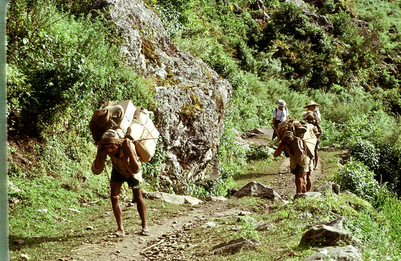 Porters carrying heavy loads. Nepal 1979