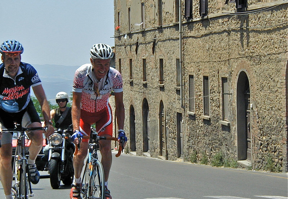 With Mark biking into Volterra, Toscana 2003