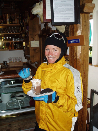 Tanya warming up with hot chocolate, Dolomites