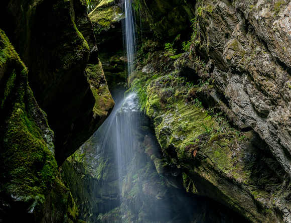 Cascading waterfall in a slot canyon